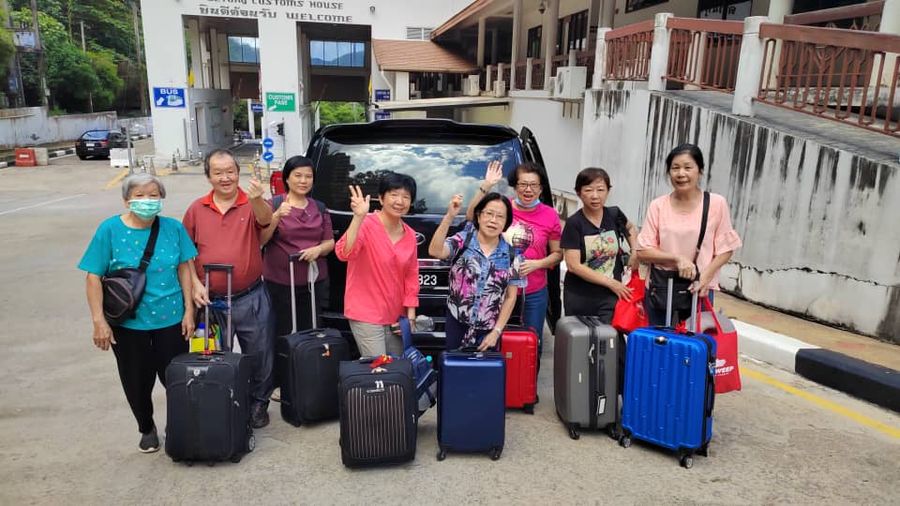A large group of travellers with their suitcases